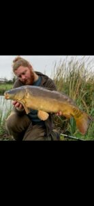 Matt Peplow proudly displaying a stunning Mirror Carp catch